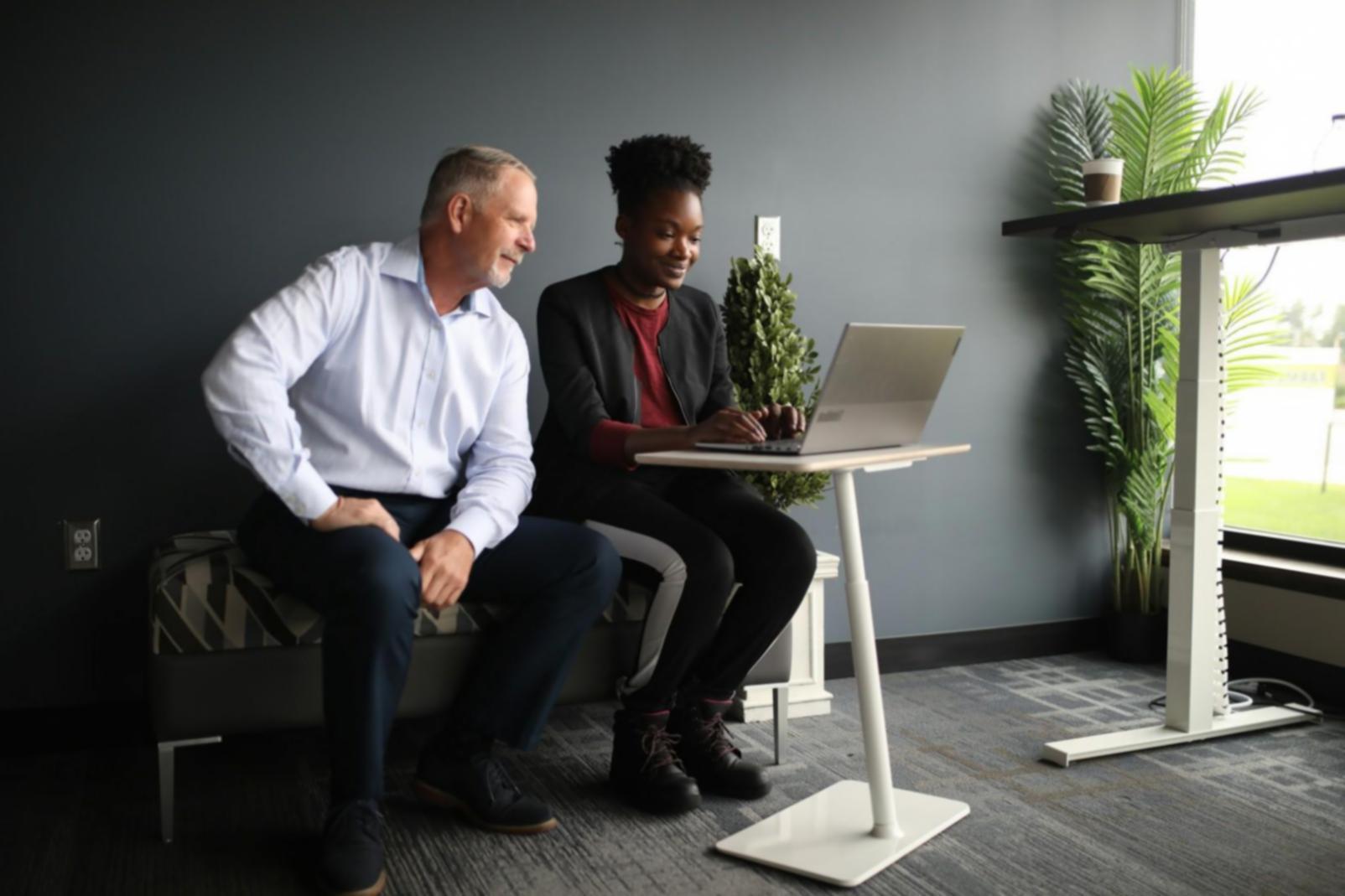Business owner reviewing financial documents and asking clarifying questions